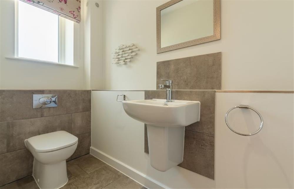 Ground floor: Cloakroom with washbasin and WC