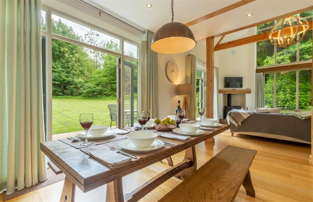 Ground floor: Dining room with french doors leading into the garden at Woodland Pytchley, West Runton near Cromer