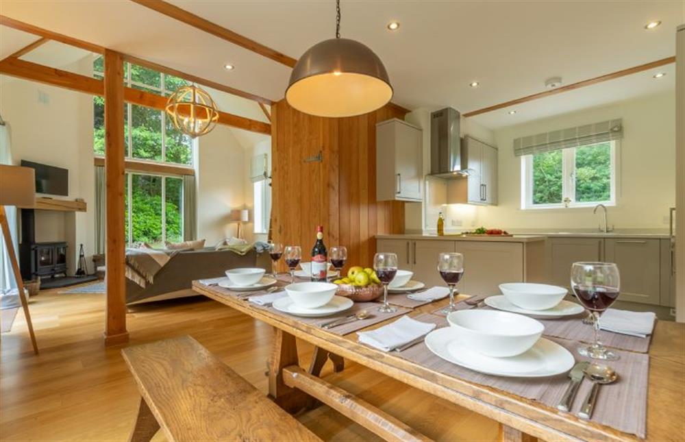 Ground floor: Dining room with oak table and two benches at Woodland Pytchley, West Runton near Cromer