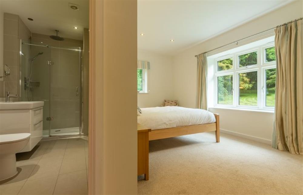 Ground floor: Master bedroom with en-suite shower room at Woodland Pytchley, West Runton near Cromer