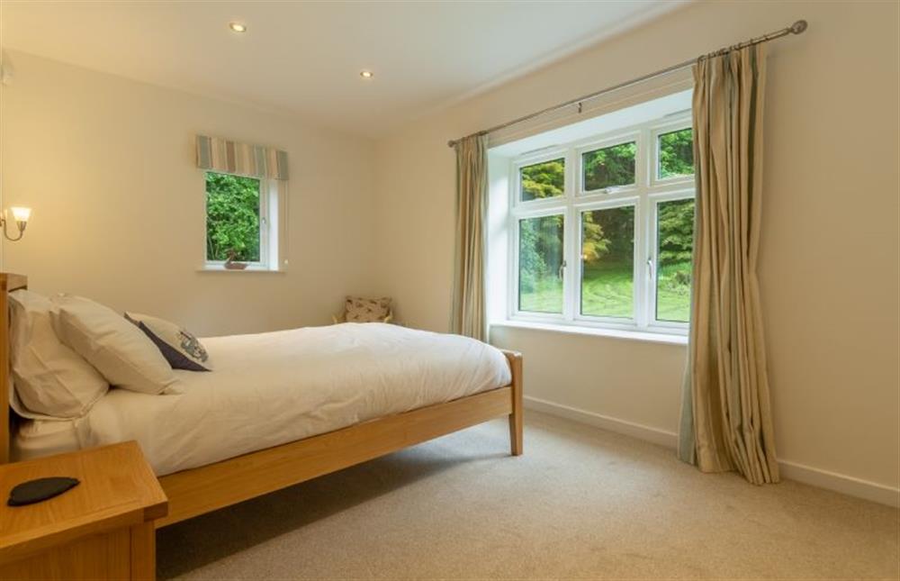 Ground floor: Master bedroom with king-size bedroom at Woodland Pytchley, West Runton near Cromer