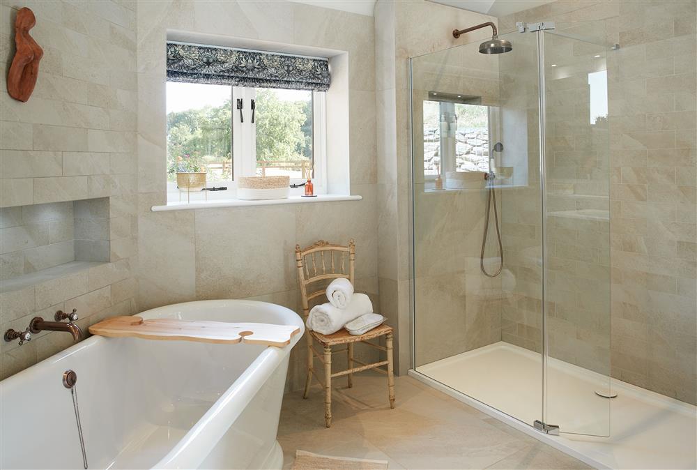 Bathroom with roll-top bath and walk-in shower at Woodland Retreat, Burton on Trent