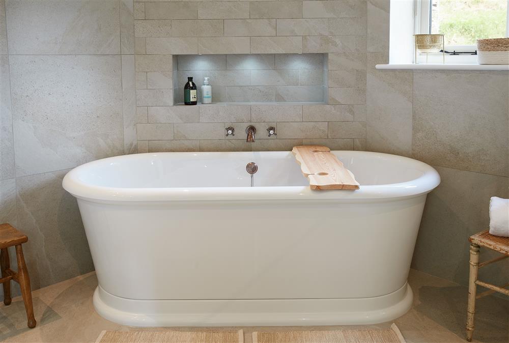 Roll-top bath, perfect for relaxing at Woodland Retreat, Burton on Trent