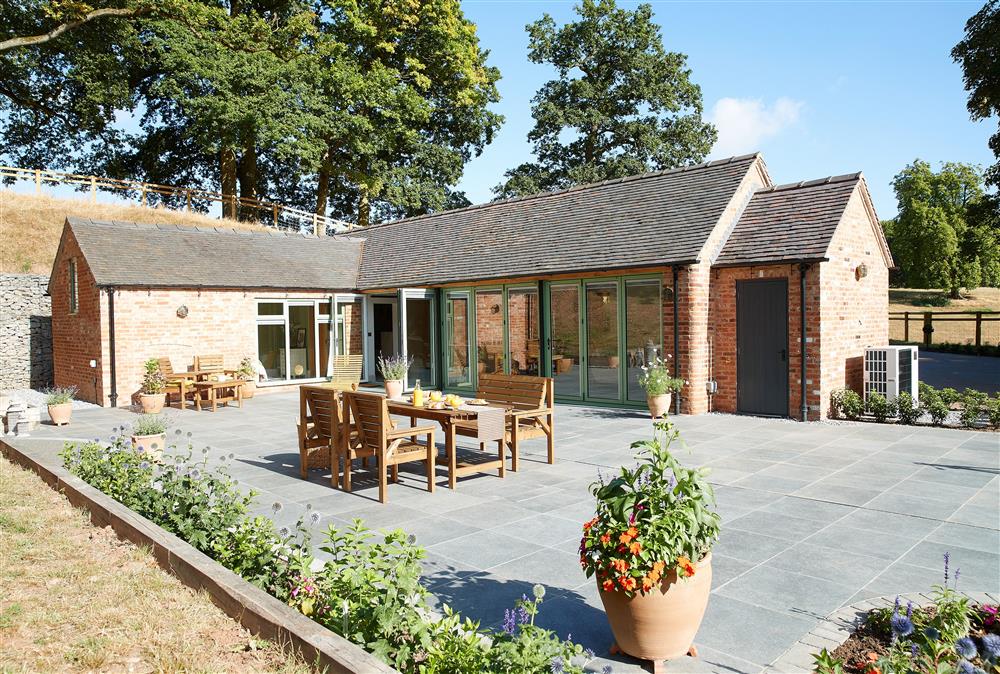 The bi-folding doors lead out onto the terrace at Woodland Retreat, Burton on Trent