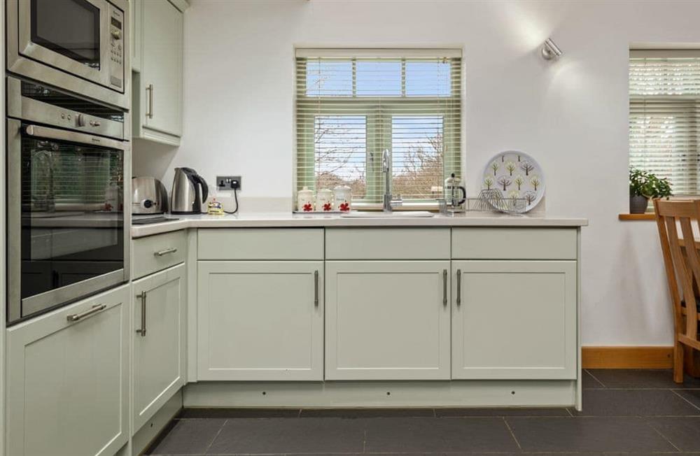 This is the kitchen at Woodland Retreat in Near Solva, Pembrokeshire, Dyfed