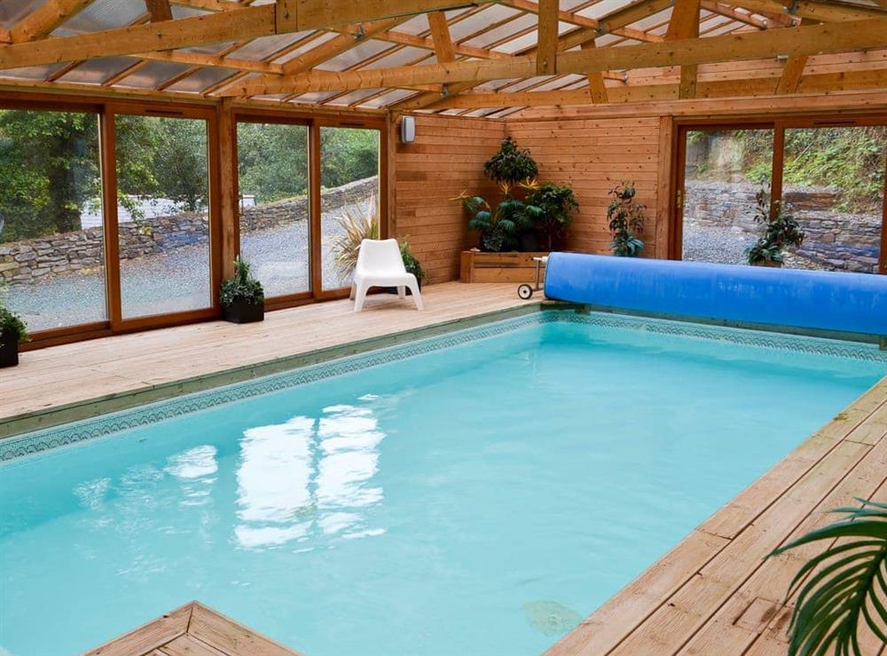 Indoor heated swimming pool at Woodland Retreat in Polbrock, Washaway, Cornwall., Great Britain
