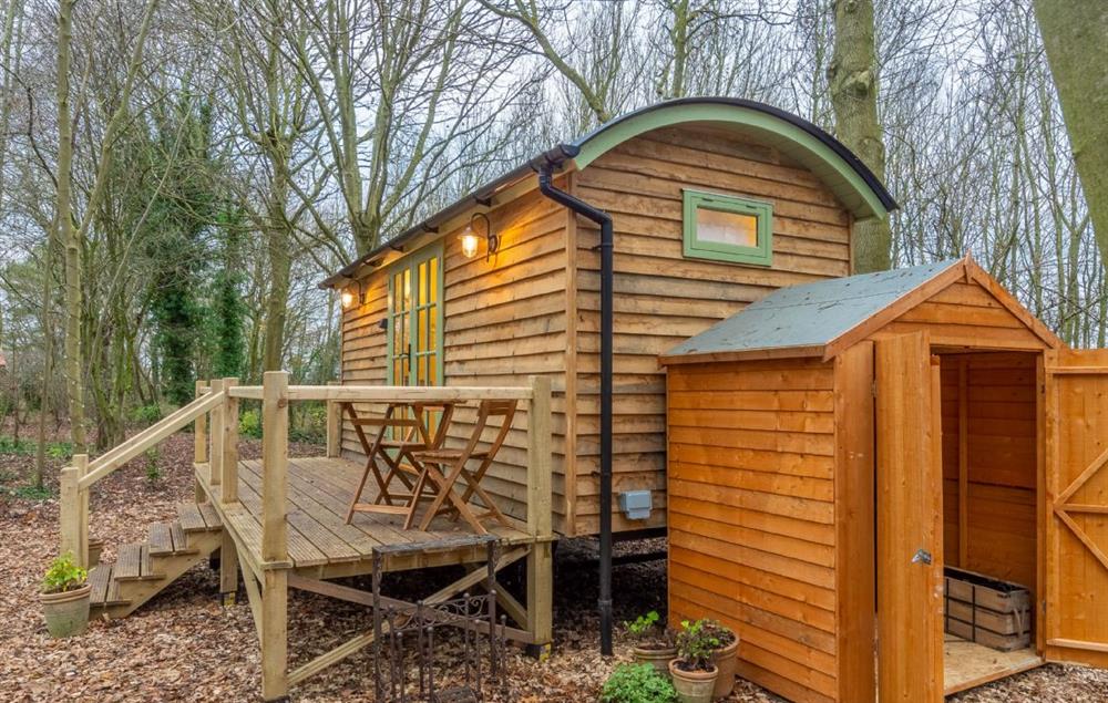 There is a convenient storage area next to the hut, perfect for storing bicycles at Woodland Retreat Shepherds Hut, Brundish