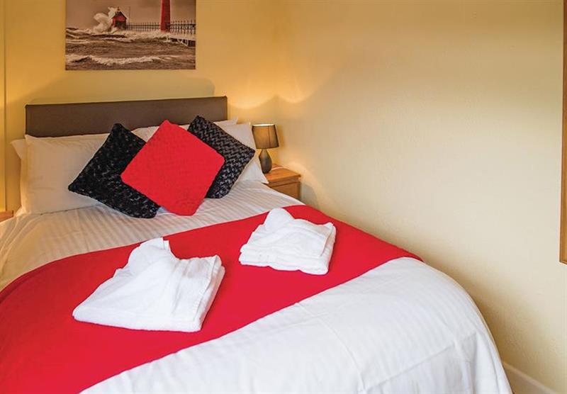 The bedroom in The Retreat at Woodland Vale Holiday Park in Ludchurch, Nr Saundersfoot