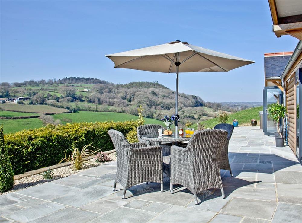 Inviting sitting-out-area with amazing views at Woodland View Lodge in Axminster, Devon