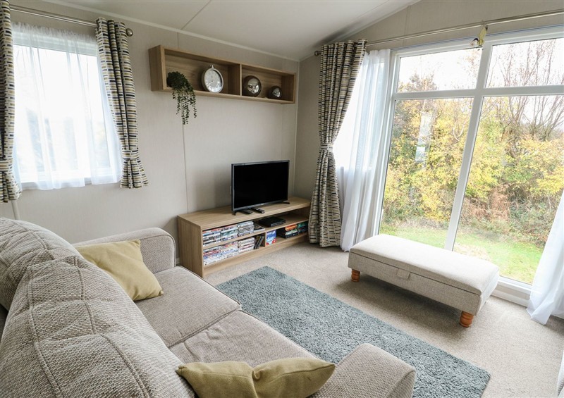 This is the living room at Woodland Way, Benllech
