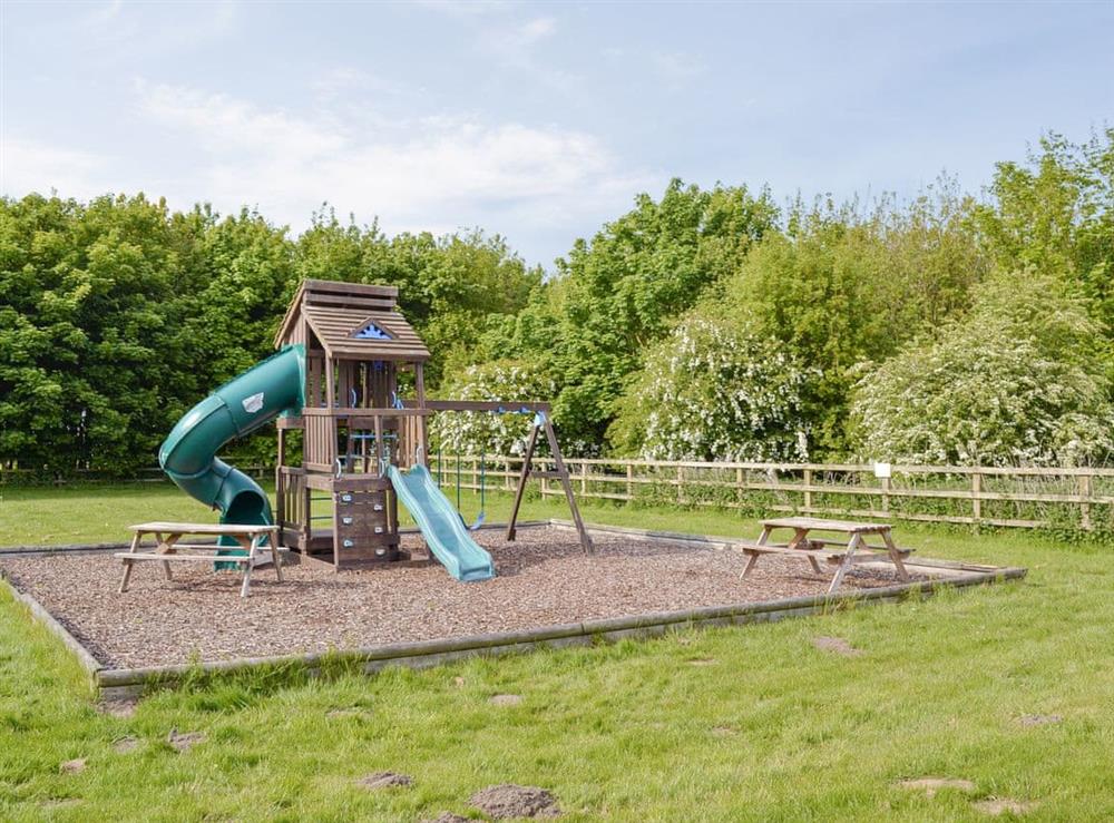 Shared children’s play area at Woodlands in Brandesburton, Nr Bridlington, East Yorkshire., North Humberside