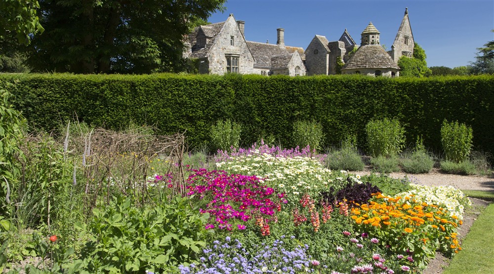 Colourful summer borders in the gardens at Woodlands Cottage in Nr Haywards Heath, West Sussex