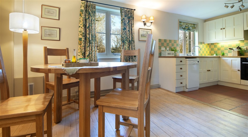 The dining and kitchen areas at Woodlands Cottage in Nr Haywards Heath, West Sussex