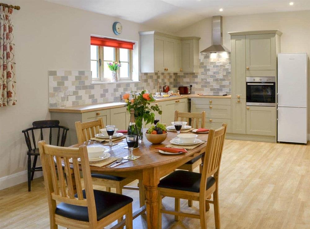 Attractive kitchen/ dining area at Woodlands Dairy Cottage in Adversane, near Billingshurst, West Sussex