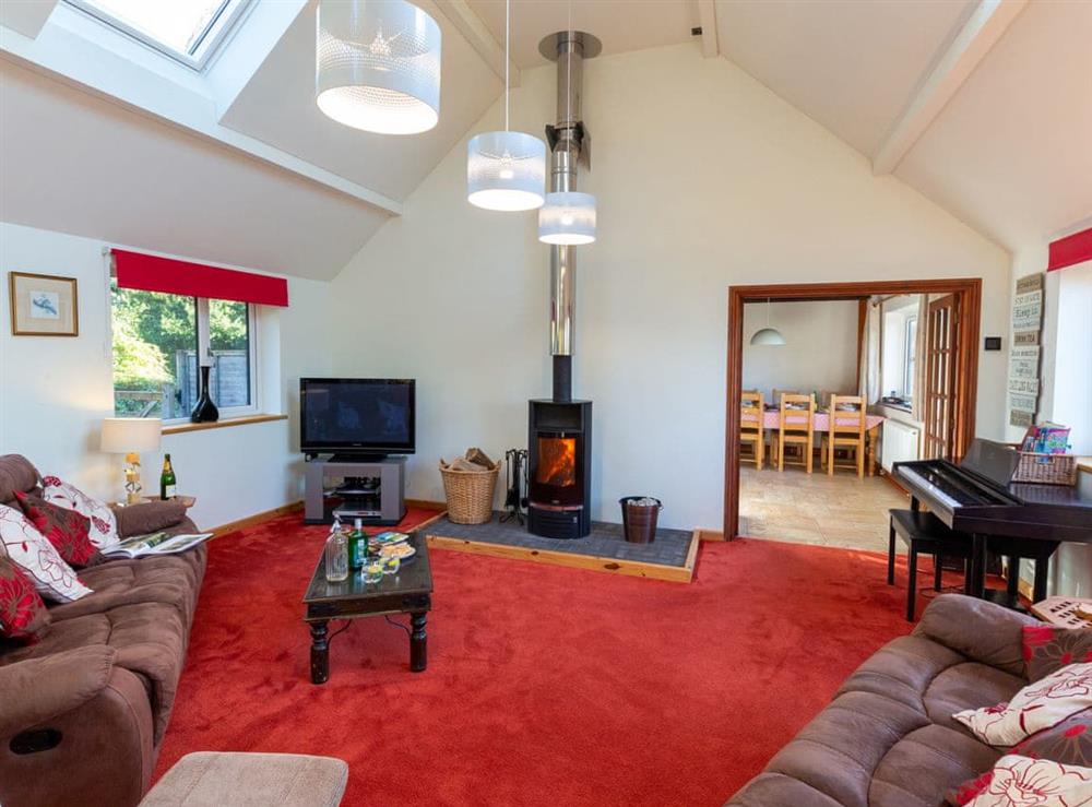 Light and airy living room with wood burner at Woodlands in Langford Budville, near Wellington, Somerset