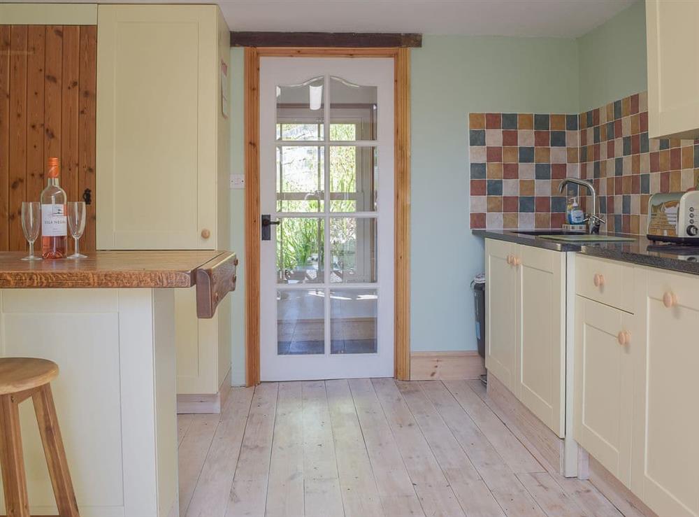 Delightful kitchen with granite tiled worktops at Woodlands in Laugharne, near Pendine, Carmarthenshire, Dyfed