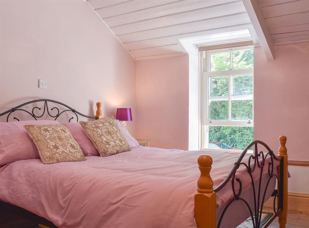 Double bedroom with wooden ceiling at Woodlands in Laugharne, near Pendine, Carmarthenshire, Dyfed