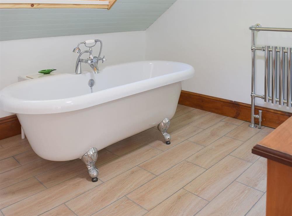 Lovely bathroom with stand alone roll top bath at Woodlands in Laugharne, near Pendine, Carmarthenshire, Dyfed