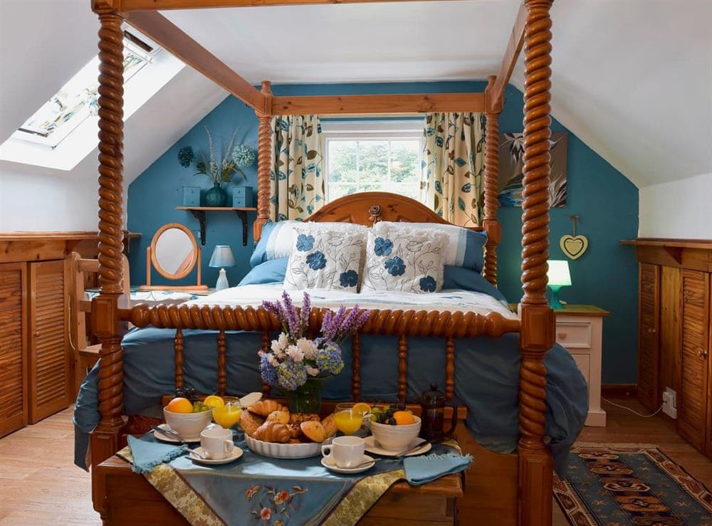 Relaxing four Poster bedroom at Woodlands Retreat in Blackbridge, near Milford Haven, Dyfed