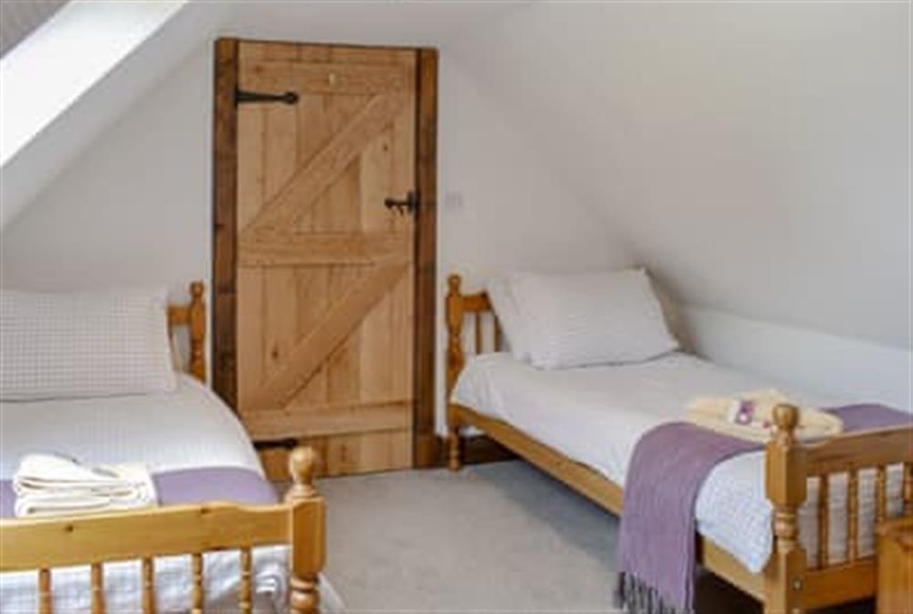Twin bedroom at Woodlea Cottage 2 in Whiting Bay, near Dippen, Isle Of Arran