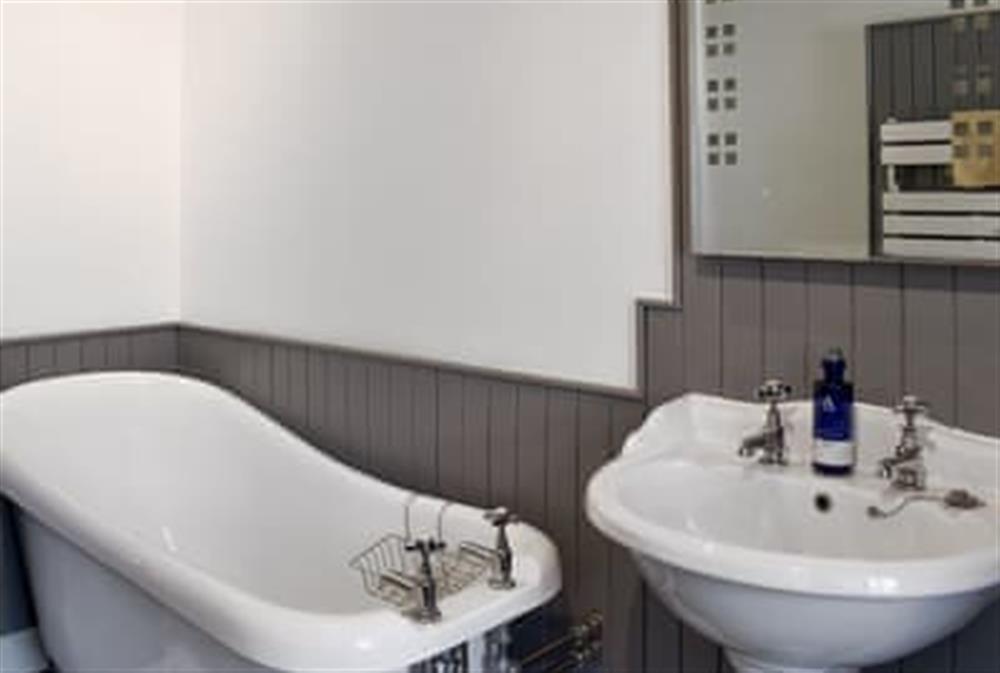 Well presented bathroom with separate free-standing, roll-top bath and shower cubicle (photo 2) at Woodlea Cottage 2 in Whiting Bay, near Dippen, Isle Of Arran