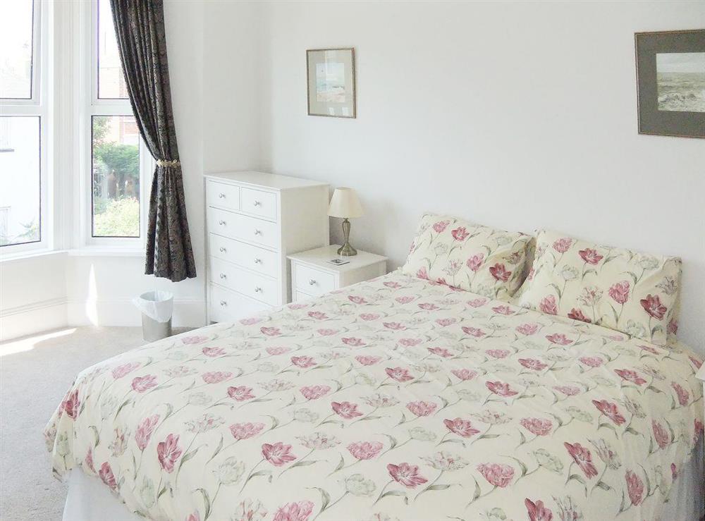 Cosy and romantic double bedroom with kingsize bed at Woodleigh in Sandown, Isle of Wight, England