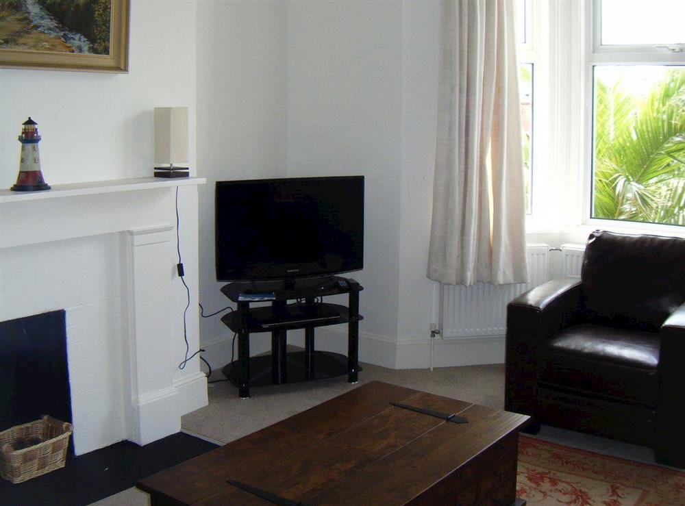 Lovely living room with comfortable leather furniture at Woodleigh in Sandown, Isle of Wight, England