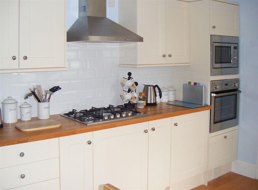 Well equipped part-tiled kitchen area at Woodleigh in Sandown, Isle of Wight, England