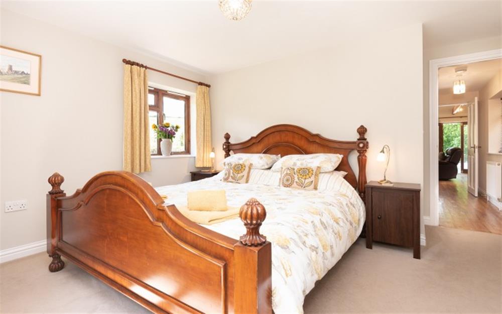 The spacious and comfortable double bedroom. at Woodpecker Cottage in Stokenham