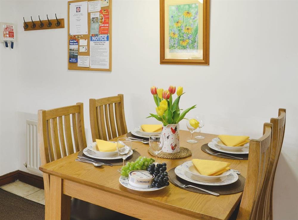 Charming dining area at Woodpecker Cottage in Wigton, Cumbria