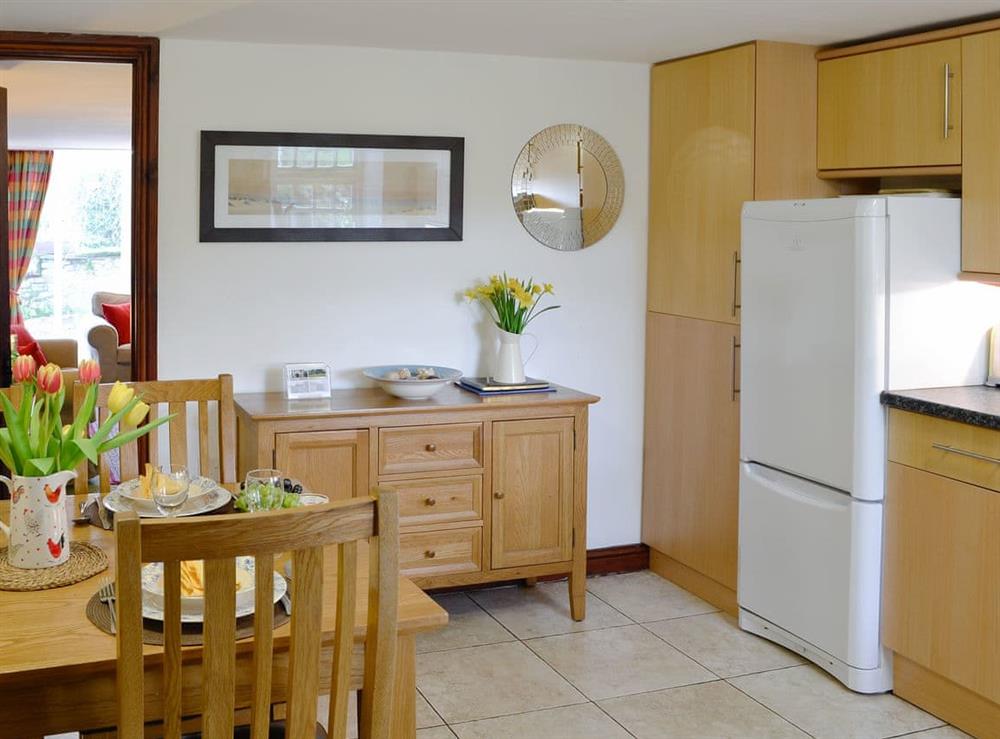 Well equipped kitchen/ dining room at Woodpecker Cottage in Wigton, Cumbria