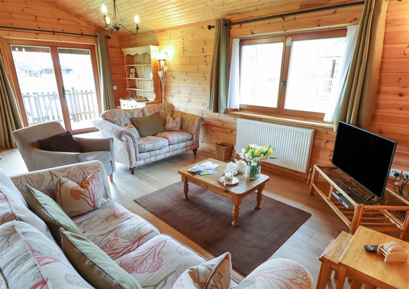 Relax in the living area at Woodpecker Lodge, Stainfield near Bardney