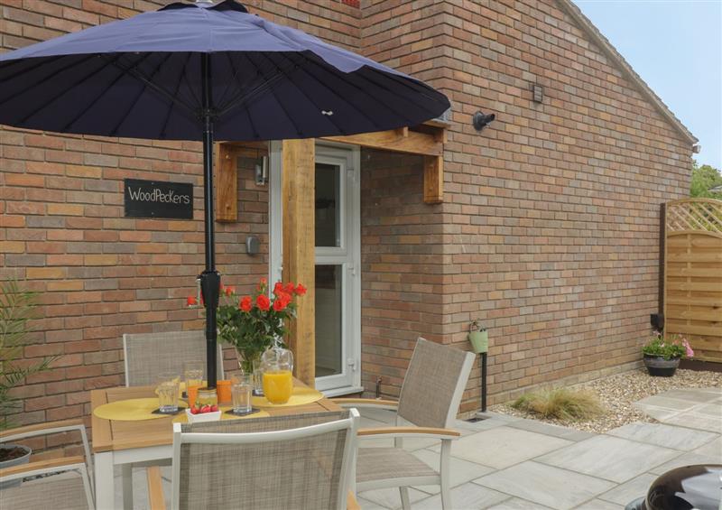 Enjoy a cup of tea on the patio (photo 2) at Woodpeckers, Alresford