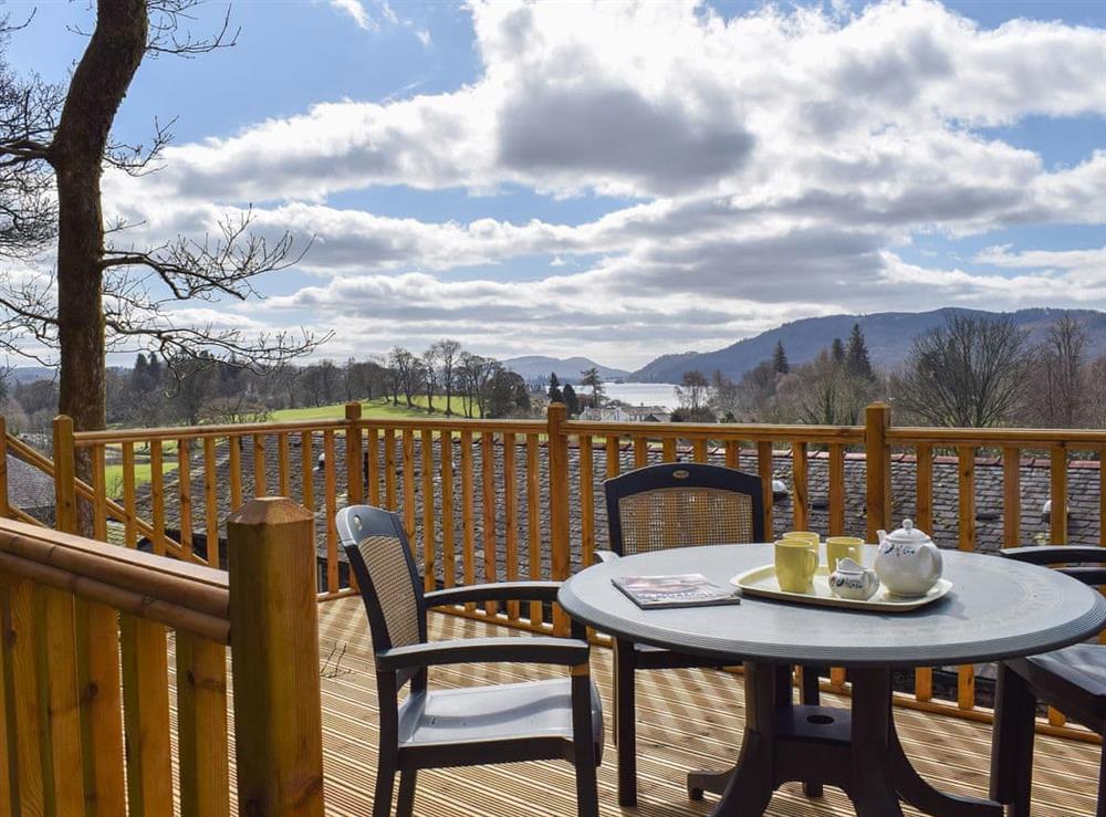 Admire the wonderful view of Lake Windermere from the decking at Woodside Cottage in Ecclerigg, near Ambleside, Cumbria