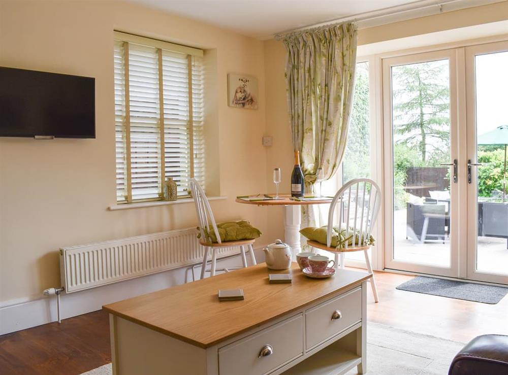 Living room/dining room with modest dining area at Woodside Cottage in Near Easington, Cleveland