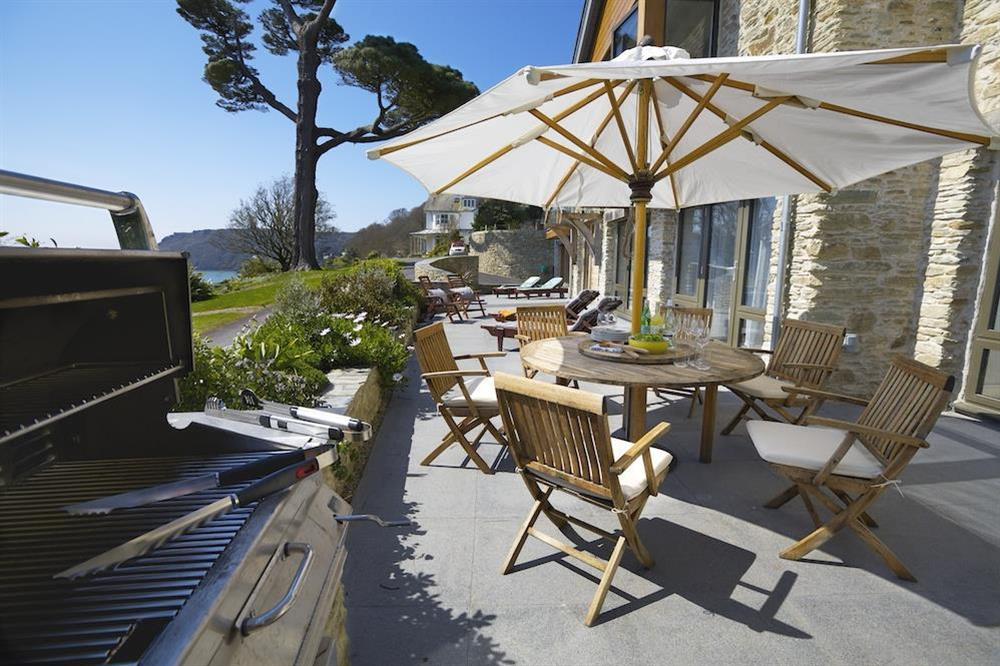 Delightful lower terrace with barbecue, garden table and chairs (photo 2) at Woodwell in , Salcombe