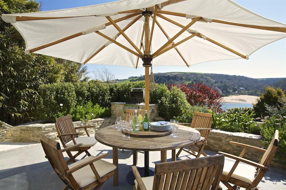 Delightful lower terrace with barbecue, garden table and chairs at Woodwell in , Salcombe