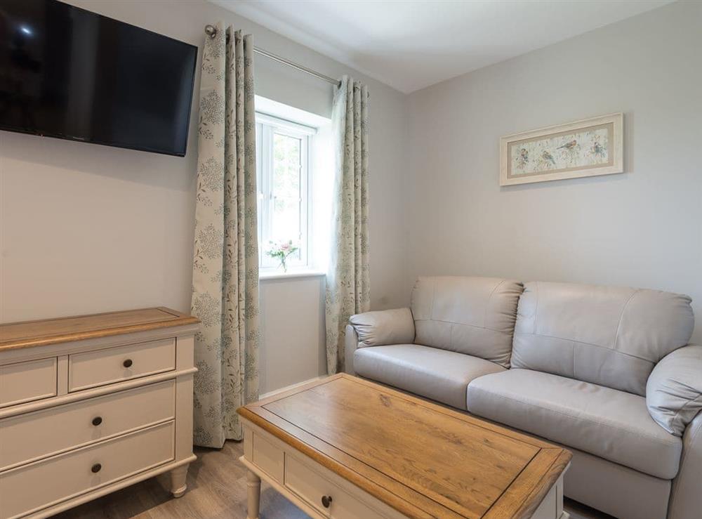 Double bedroom with seating area at Woodys Top in Ruckland, near Louth, Lincolnshire
