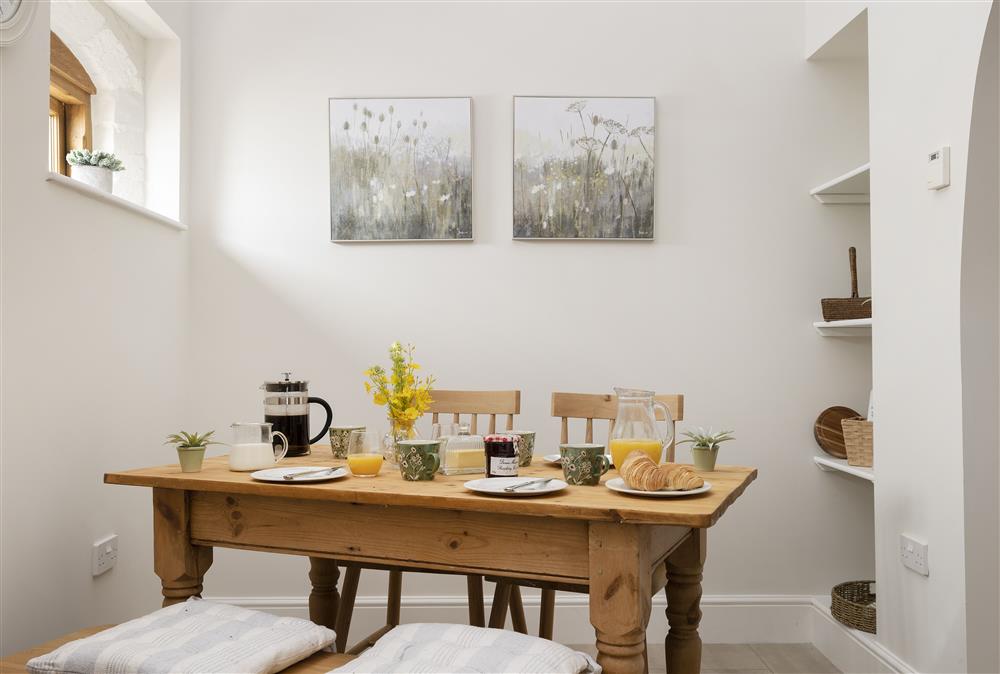 The dining area with table seating four guests at Wormsley Grange and Cottage, Hereford