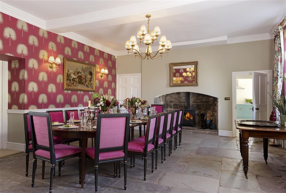 The dining room with a wood burning stove at Wormsley Grange and Cottage, Hereford