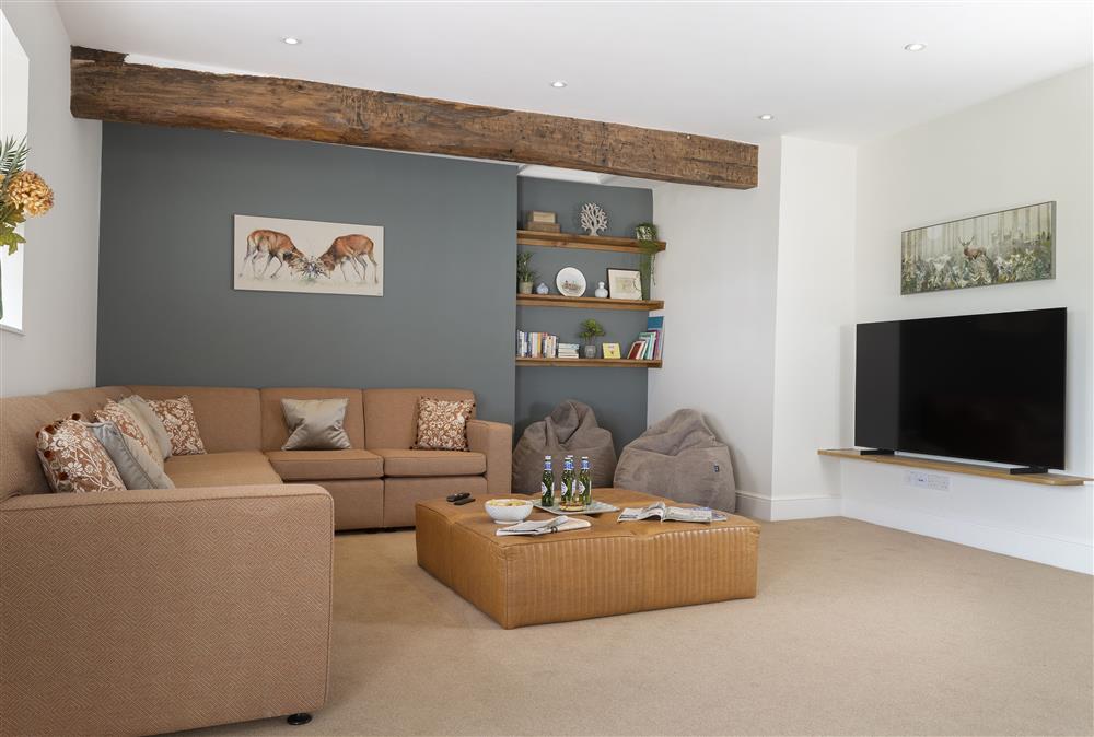 The media room boasts a 65 inch television at Wormsley Grange and Cottage, Hereford