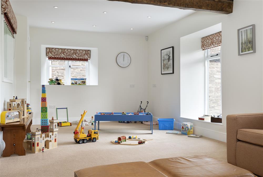 The media room, with a toy cupboard for the children at Wormsley Grange and Cottage, Hereford