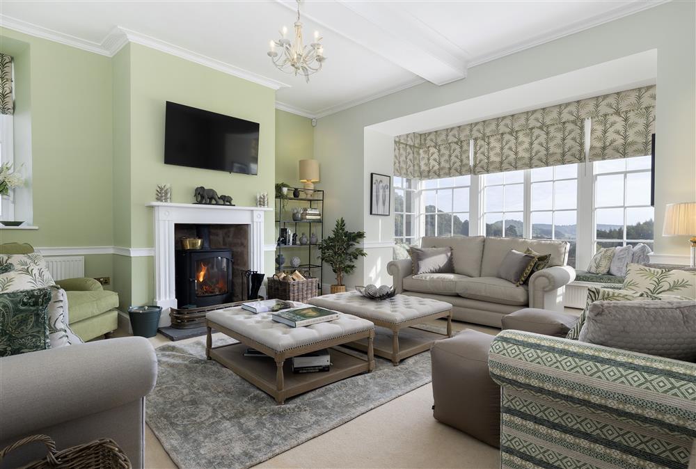 The sitting room boasts a wood burning stove at Wormsley Grange and Cottage, Hereford