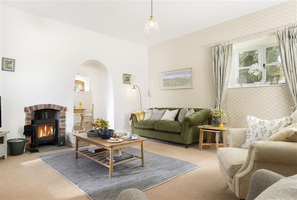 The sitting room with wood burning stove at Wormsley Grange and Cottage, Hereford