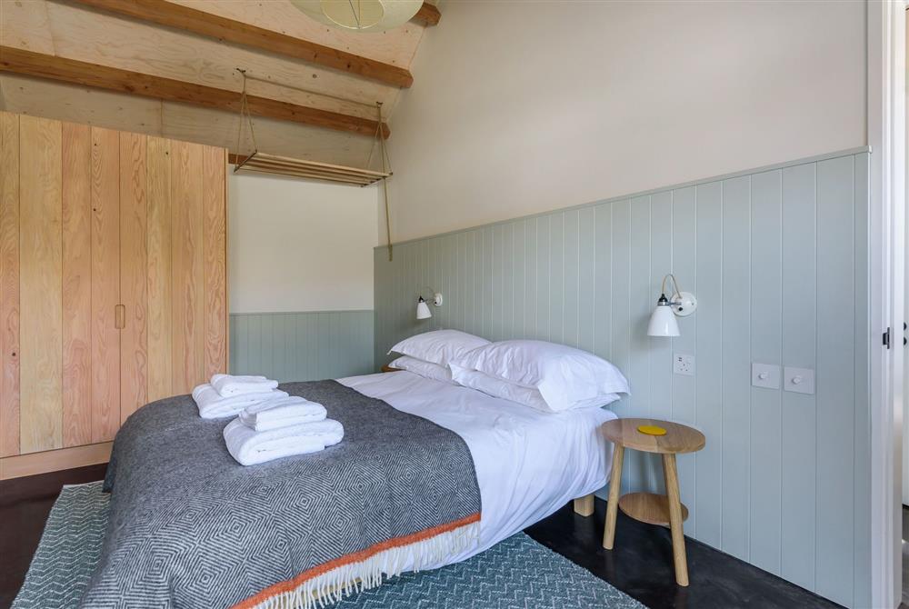 Kittwhistle for four guests, bedroom one with a 5’ king-size bed and exposed beams throughout at Wraxall Yard, Dorchester