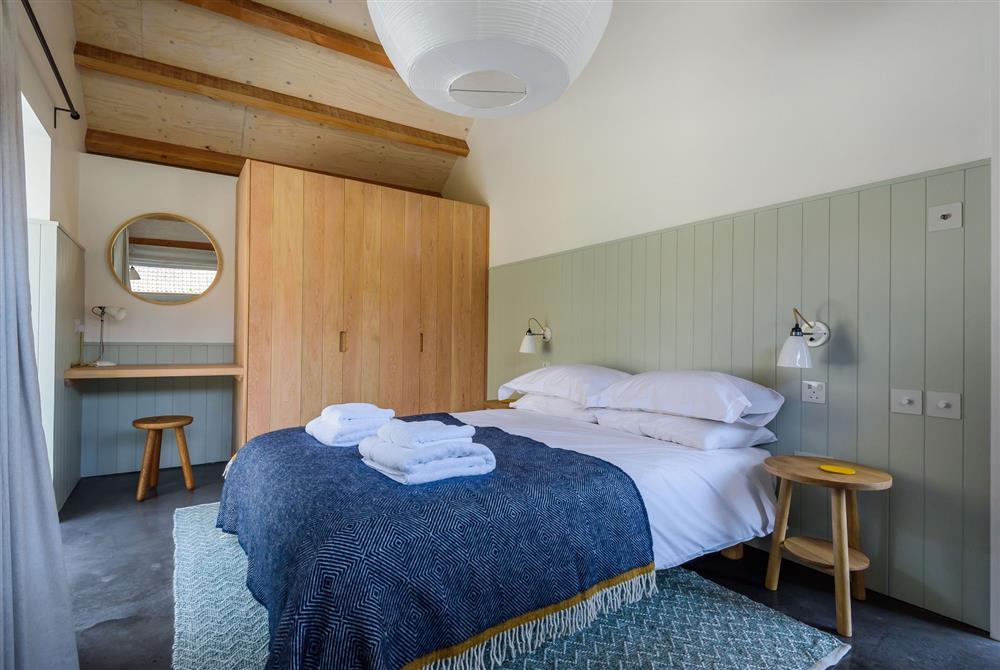 Ladymeade for three guests, bedroom one with a 5’ king-size bed at Wraxall Yard, Dorchester