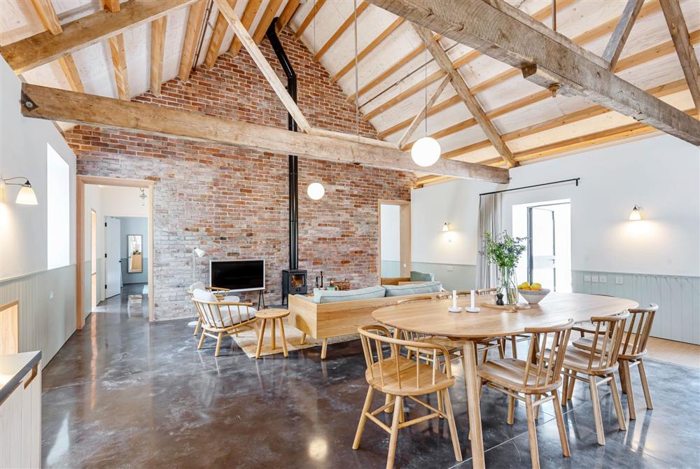 Lookout for six guests, the dining area with contemporary oak furniture at Wraxall Yard, Dorchester