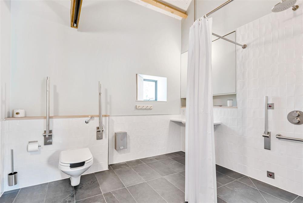 Lookout for six guests, the  wheelchair accessible en-suite wet room with hoist rail from bedroom one