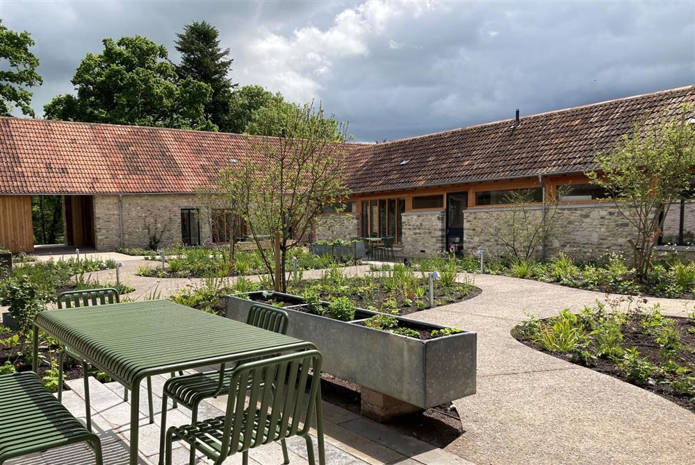 The courtyard with garden furniture at Wraxall Yard, Dorchester