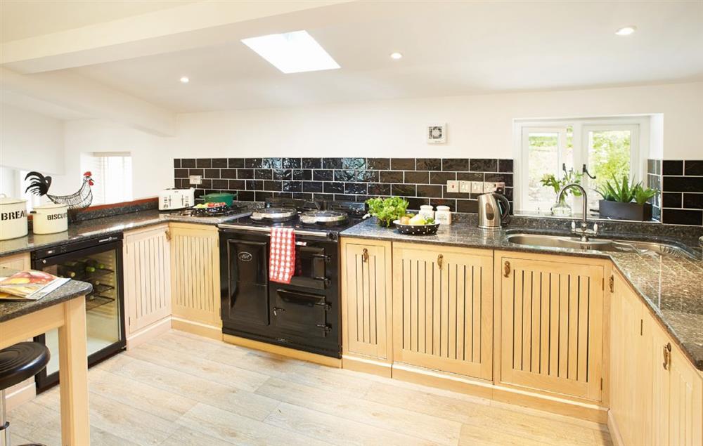 Kitchen, separate laundry room with washer and tumble dryer, cloakroom with wc at Wreay Mansions, Watermillock
